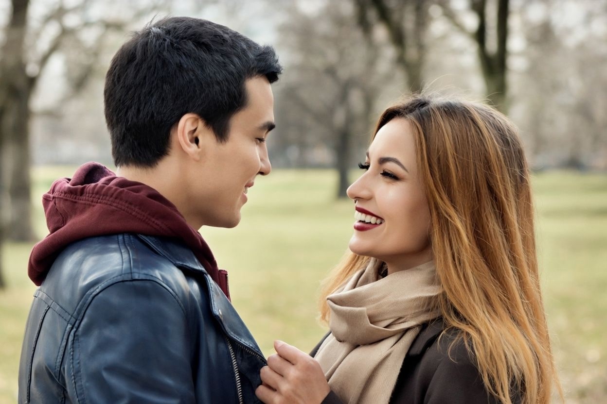 Joyful French Couple In Park With Affectionate Distance